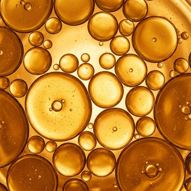Golden vitamin D2 droplets, macro